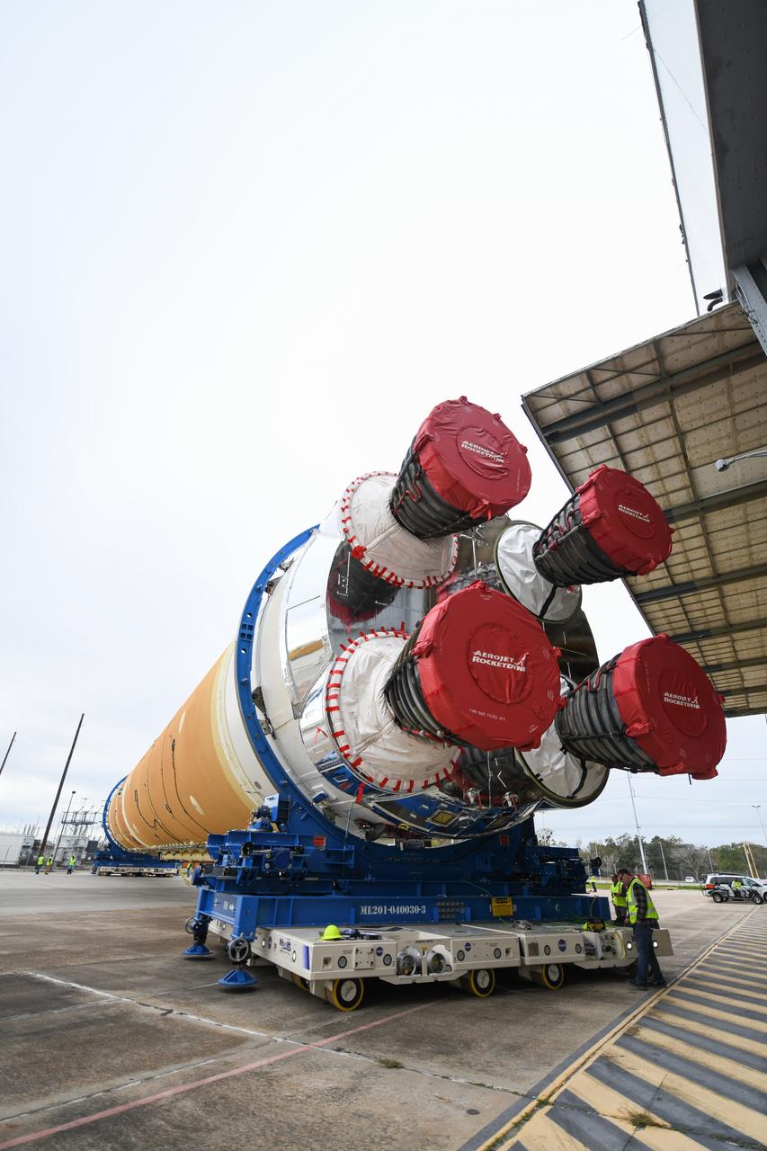 These images show how teams at NASA’s Michoud Assembly Facility in New Orleans moved the core stage, complete with all four RS-25 engines, for NASA’s Space Launch System (SLS) rocket to Building 110 for final shipping preparations on Jan. 1. The SLS core stage includes state-of-the-art avionics, propulsion systems and two colossal propellant tanks that collectively hold 733,000 gallons of liquid oxygen and liquid hydrogen to power its four RS-25 engines. The completed stage, which will provide more than 2 million pounds of thrust to help power the first Artemis mission to the Moon, will be shipped via the agency’s Pegasus barge from Michoud to NASA’s Stennis Space Center near Bay St. Louis, Mississippi, later this month. Once at Stennis, the Artemis rocket stage will be loaded into the B-2 Test Stand for the core stage Green Run test series. The comprehensive test campaign will progressively bring the entire core stage, including its avionics and engines, to life for the first time to verify the stage is fit for flight ahead of the launch of Artemis I.